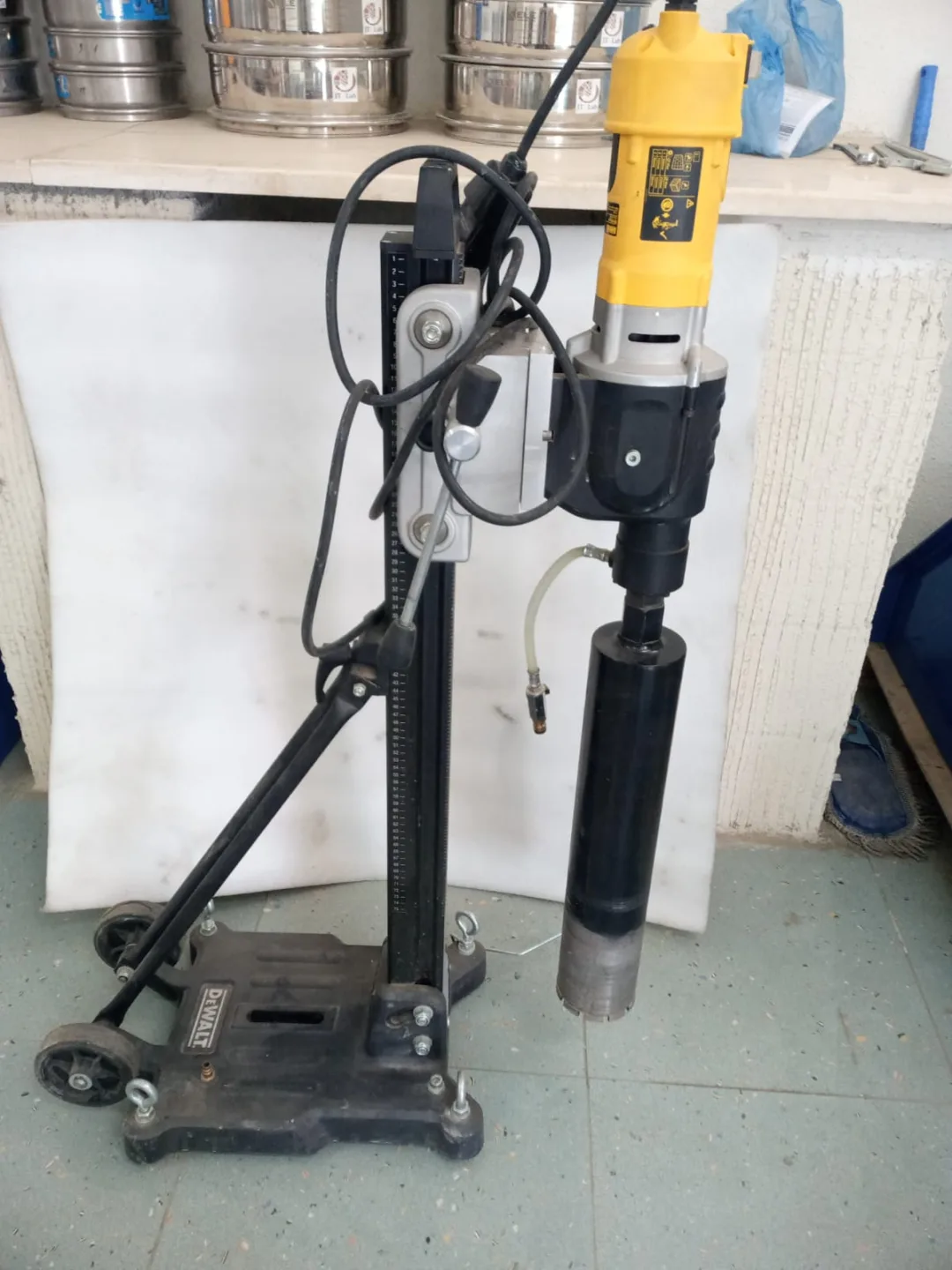 Stand-mounted concrete core-drilling machine in the laboratory