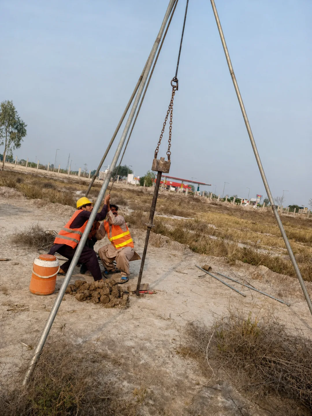 Caliber crew conducting a tripod-supported geotechnical field investigation